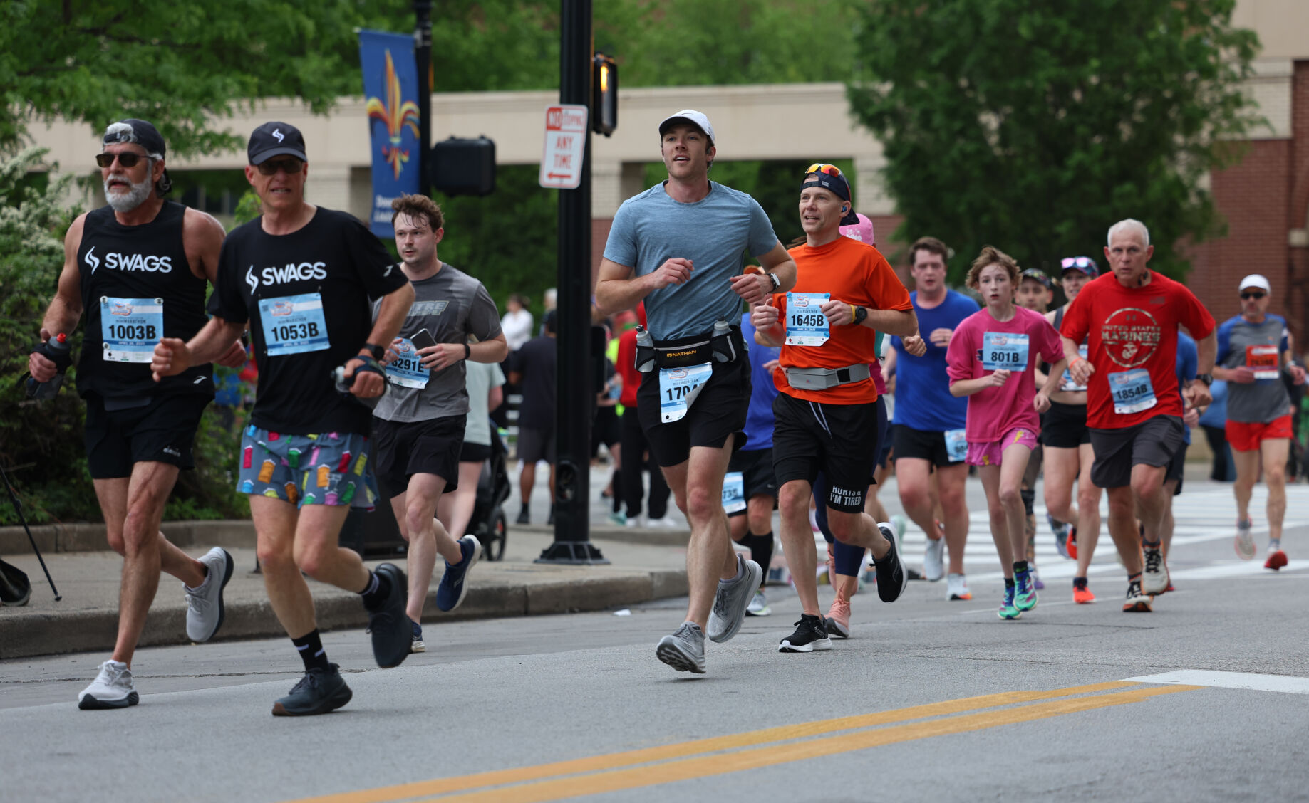 People run during the Marathon on 4th Street.JPG